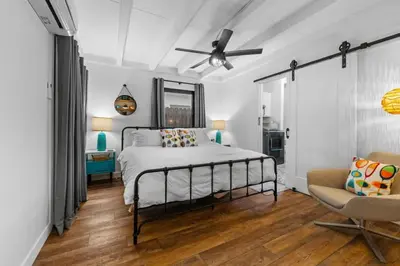 a bedroom with a bed and a ceiling fan at Luxe Beachside Escape Near Channel Islands in Oxnard