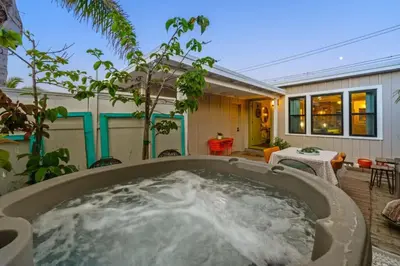 a hot tub in the backyard of a house at Luxe Beachside Escape Near Channel Islands in Oxnard
