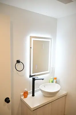 a bathroom with a white sink and a mirror at Luxe Ensuite in Shared Home-Minutes to USC in Los Angeles