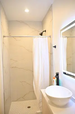 a bathroom with a sink and a shower at Luxe Ensuite in Shared Home-Minutes to USC in Los Angeles