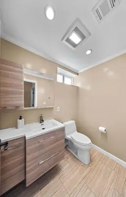 a bathroom with a white toilet and a sink at Tranquil Hideaway Private Retreat with Mountain Views in Tujunga