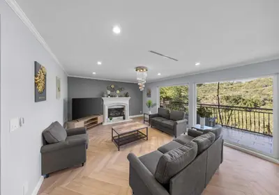 a living room with two couches and a fireplace at Tranquil Hideaway Private Retreat with Mountain Views in Tujunga