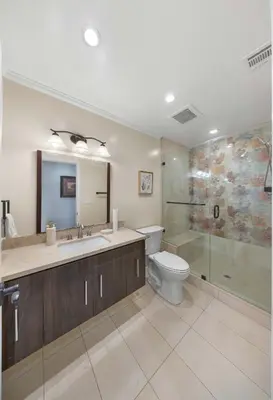 a bathroom with a toilet and a sink and a shower at Tranquil Hideaway Private Retreat with Mountain Views in Tujunga