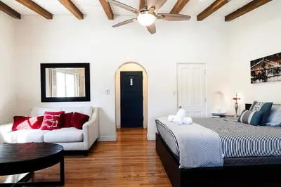 a living room with a bed and a couch at Cozy Beverly Hills Studio Near Shopping with Kitchen in Los Angeles