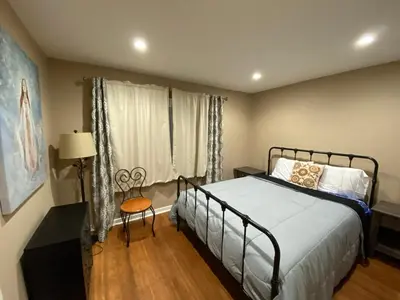 a bedroom with a large bed and a window at Family Nature Retreat Near LA with Indoor Grotto Pool in Simi Valley