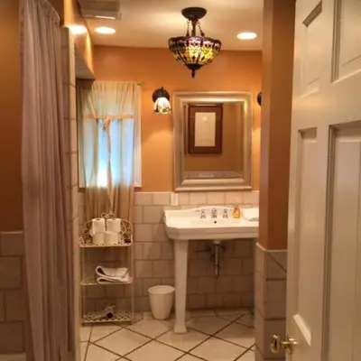 a bathroom with a sink and a mirror at Family Nature Retreat Near LA with Indoor Grotto Pool in Simi Valley