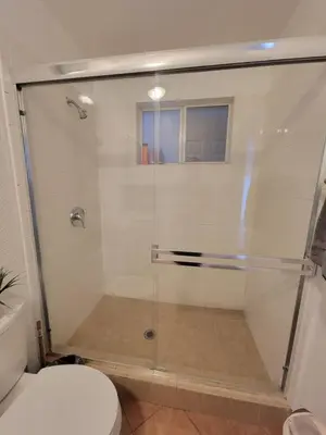 a shower with a glass door in a bathroom at 2BR Guest Suite With Parking and Garden in Pico Robertson Near Beverly Hills and Cedar Sinai in Los Angeles