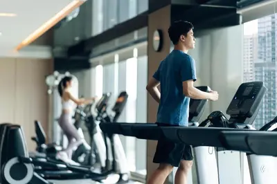a man walking on a treadmill in a gym at Hyatt Place Ontario Airport in Ontario