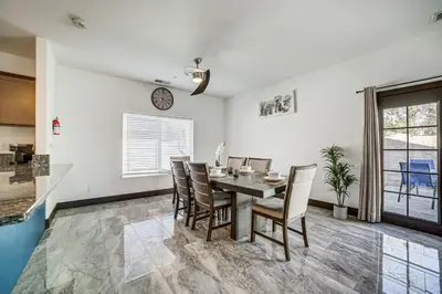 a dining room with a table and chairs at Fully Updated! Prime Riverside Spot Near Dtwn in Riverside