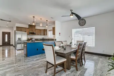 a kitchen and dining room with a table and chairs at Fully Updated! Prime Riverside Spot Near Dtwn in Riverside