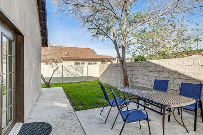 a table and chairs sitting on a patio at Fully Updated! Prime Riverside Spot Near Dtwn in Riverside