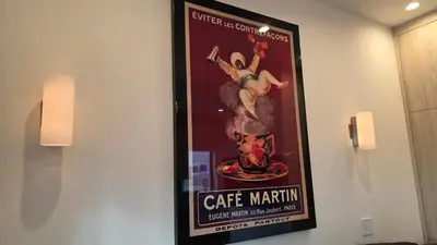 a poster of a man with a gun on a wall at Modern Studio with Kitchen Parking Near Beverly Hills and Culver City in Los Angeles