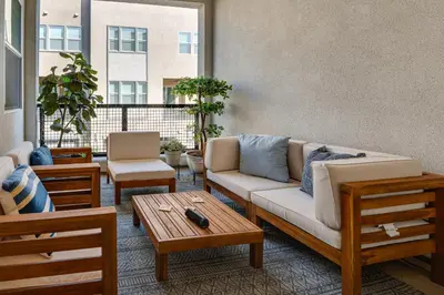 a living room with a couch and a table at 12 Mi to DTLA! Multi-Level Charmer with Pool Access in Montebello