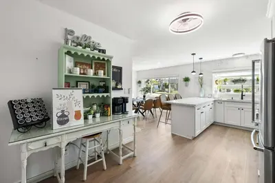 a kitchen with a counter and a dining room at Private 3BR Home - Hot Tub, Yard, Arcade & Parking in Simi Valley