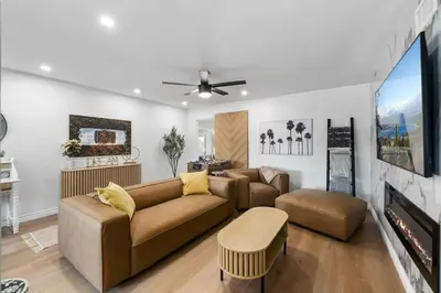 a living room with two couches and a fireplace at Private 3BR Home - Hot Tub, Yard, Arcade & Parking in Simi Valley