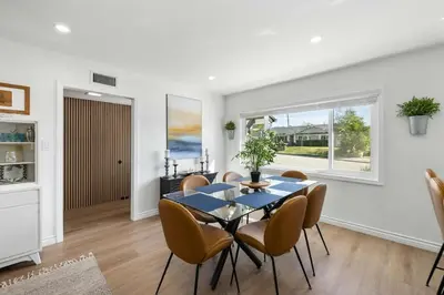 a dining room with a table and chairs at 2BR 2BA Home Hot Tub, Firepit, Yard, BBQ, Parking in Simi Valley