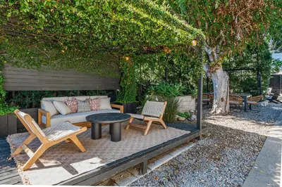 a patio with a couch and chairs and a table at Modern Luxe Studio in East Los Angeles in Los Angeles