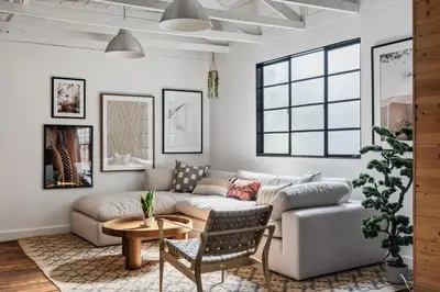 a living room with a couch and a table at Elegant 3-bedroom home Retreat in East Los Angeles in Los Angeles