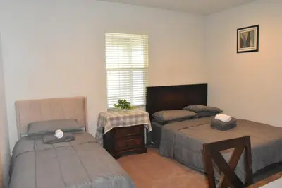 a bedroom with two twin beds and a window at Cozy 2-Bedroom Home in Eastvale in Corona