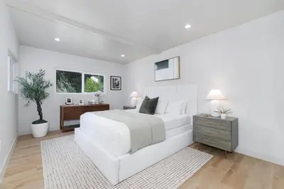 a white bedroom with a white bed and a desk at Chic WeHo Retreat near Sunset Blvd in Los Angeles