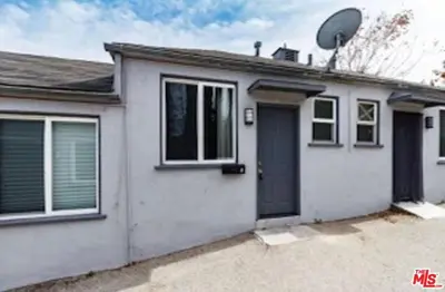 a white house with a satellite at Cozy Studio Apt Studio City Unit 5 in Los Angeles