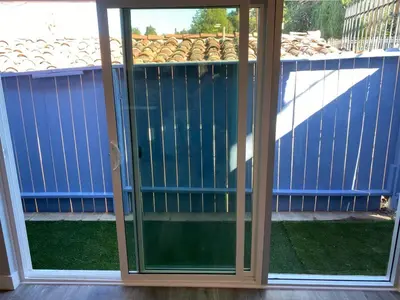 a screened in porch with sliding glass doors at Cozy 1 Bedroom Tarantino Unit Studio City in Los Angeles
