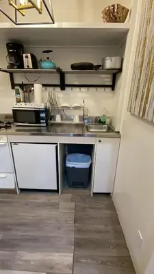 a kitchen with a sink and a counter at Cozy Studio by Rodeo Drive in Los Angeles