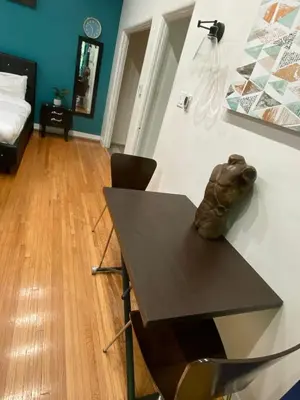 a room with a table and a bed at Cozy Studio by Rodeo Drive in Los Angeles