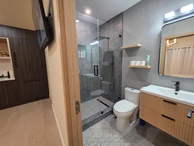 a bathroom with a shower and a toilet and a sink at Private Studio City Suite Walk to Universal-15 min in Los Angeles