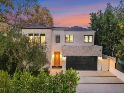 a house with a garage at sunset at Colfax Estate in Los Angeles