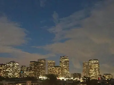 a city skyline at night with lit up buildings at Fara UCLA in Los Angeles