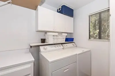 a kitchen with a white stove and a dishwasher at Arrowhead Cabin Near Lake and Village in Lake Arrowhead