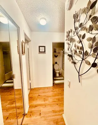 a hallway with a bathroom with a toilet in a room at Sweet 2 bedrooms home by the beach city in Los Angeles