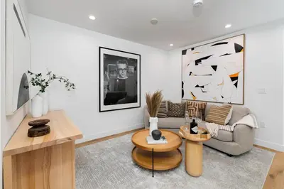 a living room with a couch and a table at Modern Mid-Wilshire Escape Prime Spot in Los Angeles
