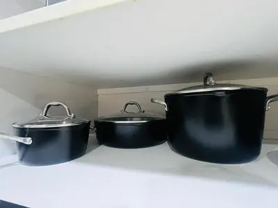 three pots and pans sitting on a kitchen counter at Stylish & Fully Renovated Home! in Oxnard