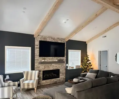 a living room with a couch and a fireplace at Bearadise, LuxuryNew Build, Central, Hot Tub, EV ,Games in Big Bear Lake