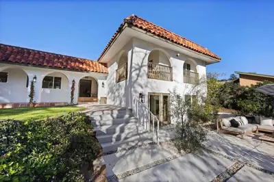 a large white house with a patio at Lavender House - Serene Ojai Retreat, Pool, Orchard in Ojai