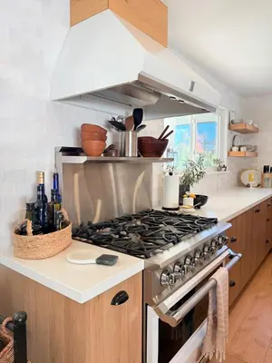 a kitchen with a stove top oven in a kitchen at Lavender House - Serene Ojai Retreat, Pool, Orchard in Ojai