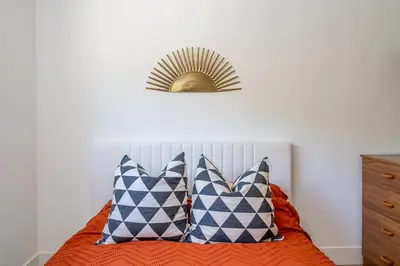a bedroom with a bed with two pillows at Newly remodeled home w pool & private back yard in Thousand Oaks