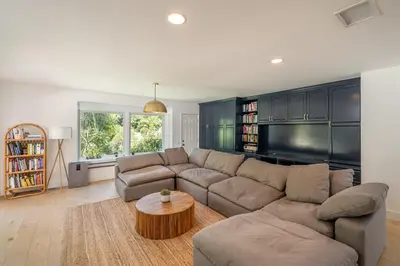 a living room with a couch and a table at Newly remodeled home w pool & private back yard in Thousand Oaks