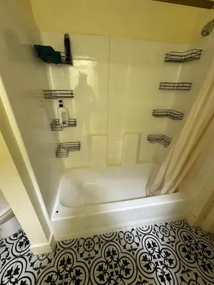 a white bath tub in a bathroom with a tile floor at Shared room, Prime Location LA in Los Angeles