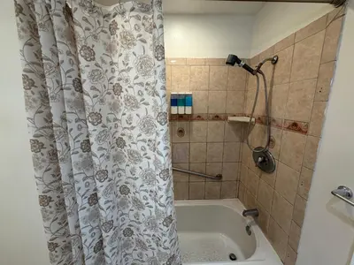 a shower curtain in a bathroom with a tub at Dream House Retreat LLC in Los Angeles