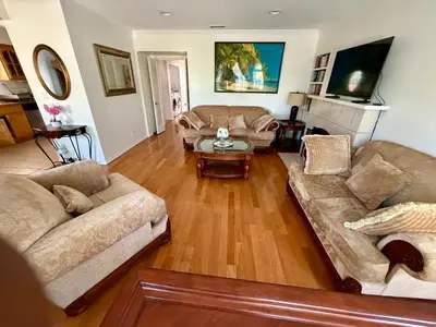 a living room with two couches and a table at Dream House Retreat LLC in Los Angeles