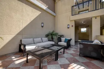 a living room with a couch and a table at Blueground Playa del Rey pool nr Dockweiler LAX-1431 in Los Angeles