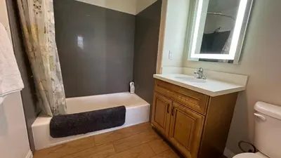 a bathroom with a sink and a toilet and a bath tub at Modern 2BD Apartment with 2 Baths in Alhambra in Alhambra