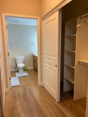 an empty bathroom with a toilet and a closet at Modern 2BD Apartment with 2 Baths in Alhambra in Alhambra