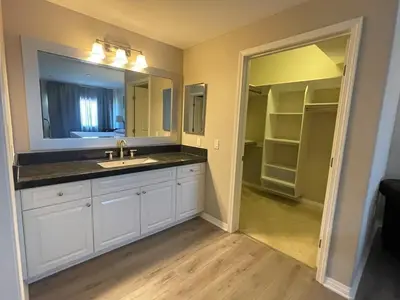 a bathroom with a sink and a mirror at Spacious 2 Bed, 2-Bath Apartment in Monterey Park in Monterey Park