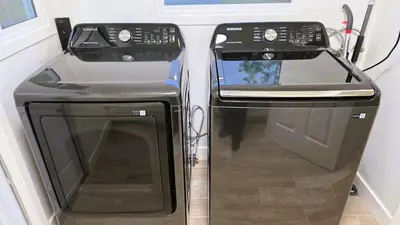 a front view of a stove and a refrigerator at Renovated Three Bedroom Near Cedars Sinai and Beverly Hills With Parking in Los Angeles