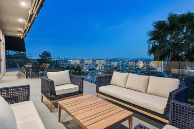 a patio with a couch and chairs and a table at Hollywood Hills Luxury Nest Views Pool Spa in Los Angeles