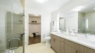 a bathroom with a sink and a toilet and a shower at Runway Playa Vista in Los Angeles
